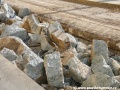 Rozbitá betonová deska, na níž byly uloženy velkoplošné panely BKV v sobě obsahovala také železobetonové pražce | 7.6.2010