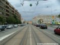 Tramvajová trať pokračuje středem ulice Milady Horákové ke světelně řízené křižovatce s Korunovační ulicí a vyústěním Letenského tunelu