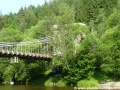 Řetězový most ve Stádleci nad Lužnicí, jehož pylon se skrývá za vzrostlými stromy. | 5.6.2011