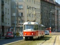 Od zastávky Vinice míří Černokosteleckou ulicí souprava vozů T3 ev.č.6710+6705 vypravená na linku 11 k zastávce Solidarita. | 30.7.2004