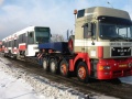Vůz RT6N1 #9101 cestuje zimní krajinou na silničním tahači do šumperské firmy Pars Nova, a.s. k úpravě na typ RT6N2. | 21.1.2004